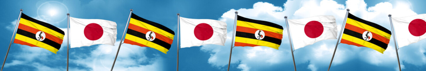 Uganda flag with Japan flag, 3D rendering
