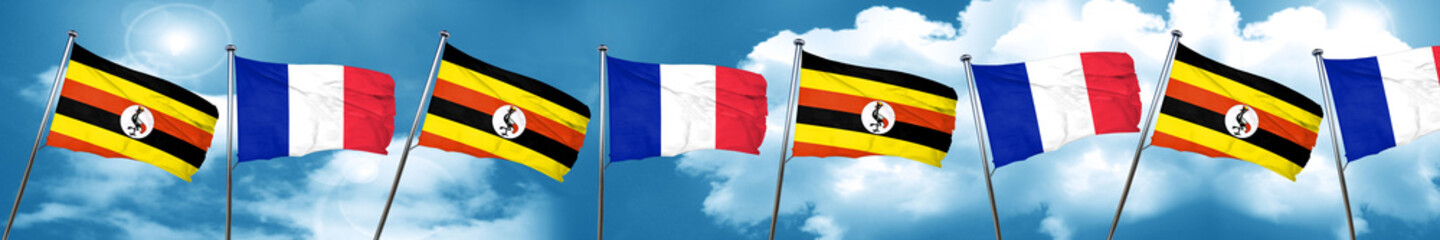Uganda flag with France flag, 3D rendering