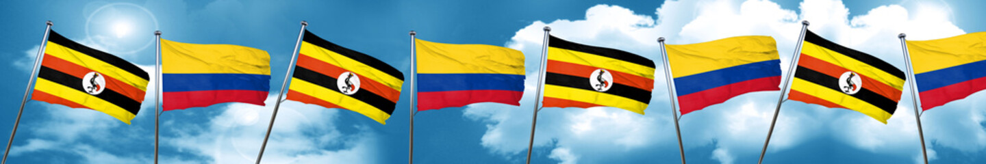 Uganda flag with Colombia flag, 3D rendering