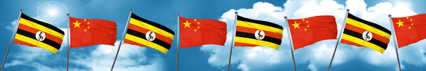 Uganda flag with China flag, 3D rendering