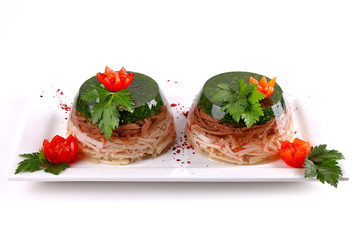 Aspic decorated with dill and cherry tomatoes