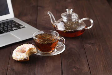Tea for breakfast with fresh pastry donuts