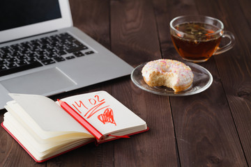 Breakfast for valentine day with tea and donut
