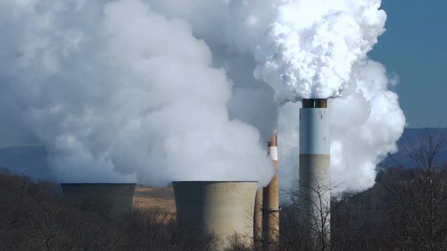 4K video of smoke billowing from coal powered power station in West Virginia
