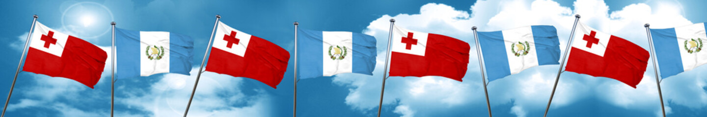 Naklejka na ściany i meble Tonga flag with Guatemala flag, 3D rendering