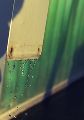 Drops of water after rain. Part of the pipe for rain water drain