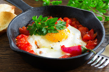 Scrambled eggs with roasted tomatoes.