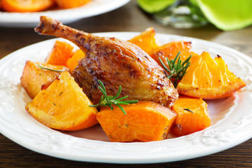 Roast duck with pumpkin and oranges.