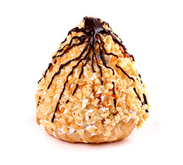 Custard cookie covered with chocolate and nuts isolated