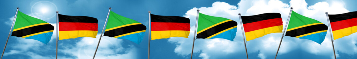 Tanzanian flag with Germany flag, 3D rendering
