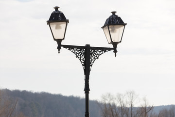 Fototapeta na wymiar street lamp with droppings from birds