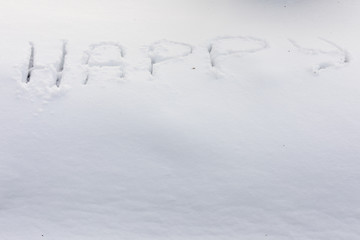 the inscription on the snow - happy