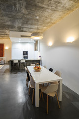 modern kitchen with gray tile floor and white wall