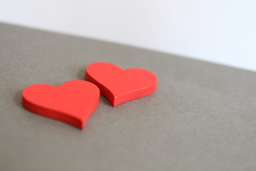 Valentines day. Red hearts on gray background. 