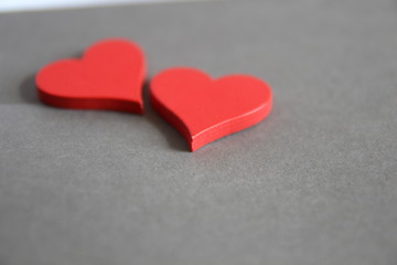 Valentines day. Red hearts on gray background. 