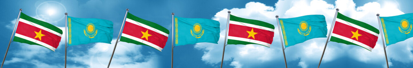 Suriname flag with Kazakhstan flag, 3D rendering