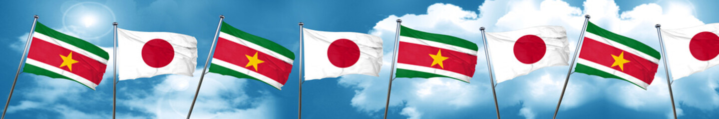 Suriname flag with Japan flag, 3D rendering
