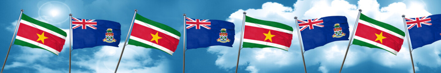 Suriname flag with Cayman islands flag, 3D rendering