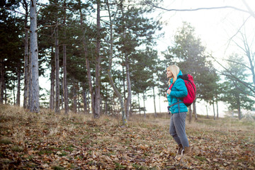 Woman hiking on sunny winter day in mountain