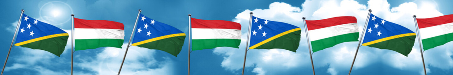 Solomon islands flag with Hungary flag, 3D rendering