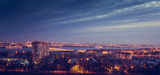 mysterious dramatic night cityscape view of Voronezh city after sunset. Houses