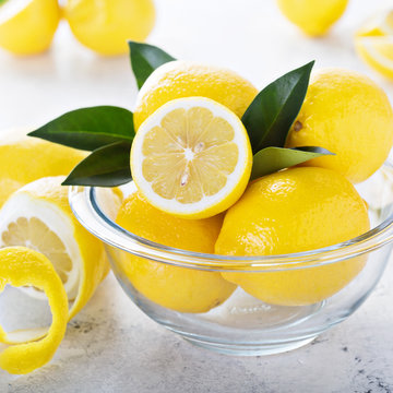 Fresh Lemons In A Glass Bowl