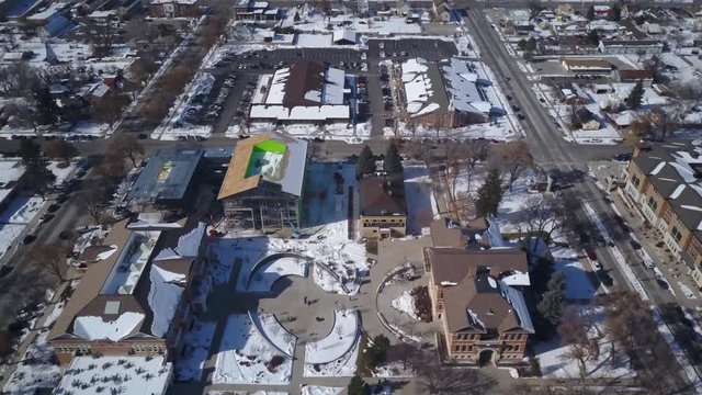 Aerial Ephraim Utah Snow College LDS church buildings. Aerial point of view. Winter storm and blizzard drops over a foot of fresh white snow. Rural farm community.