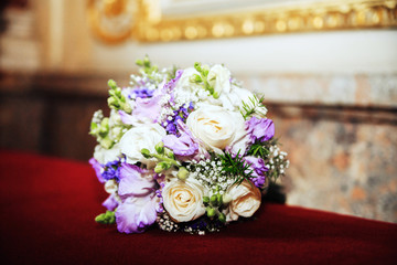 Wedding bouquet of white and purple. The concept of wedding