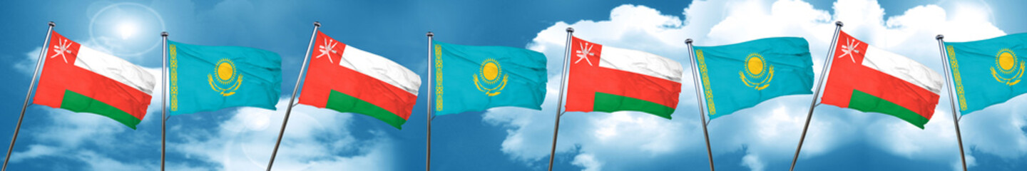 Oman flag with Kazakhstan flag, 3D rendering