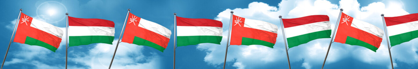 Oman flag with Hungary flag, 3D rendering