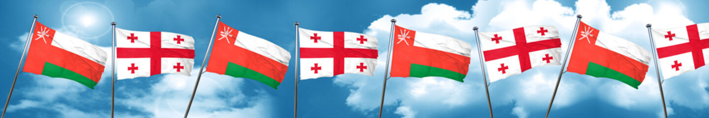 Fototapeta na wymiar Oman flag with Georgia flag, 3D rendering