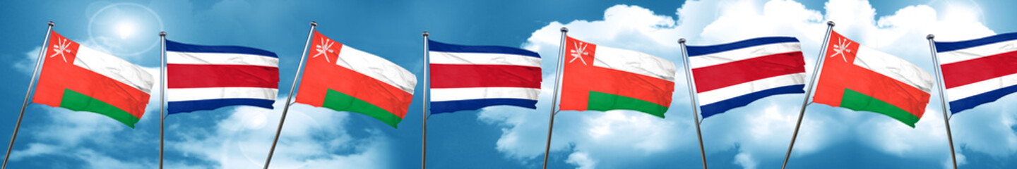Oman flag with Costa Rica flag, 3D rendering
