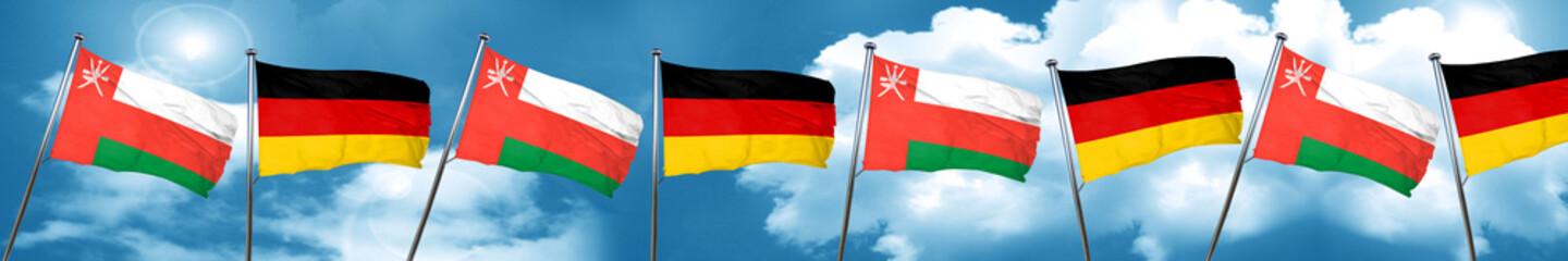 Fototapeta na wymiar Oman flag with Germany flag, 3D rendering