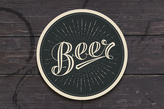 Coaster for beer with hand drawn lettering Beer. Monochrome vintage drawing for bar, pub and beer themes. Black circle for placing a beer mug or a bottle over it with lettering. Vector Illustration
