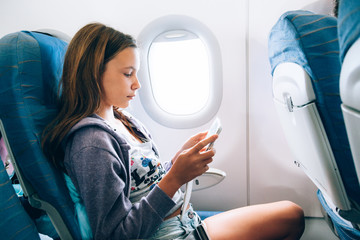 Child flying in airplane