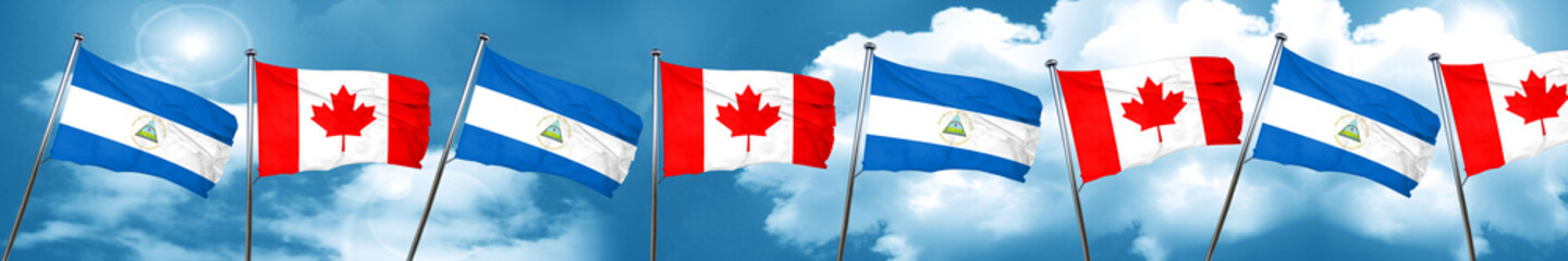 nicaragua flag with Canada flag, 3D rendering