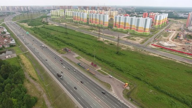 New dwelling district with multistory buildings is near the city ring way at the north of St. Petersburg, Russia. Aerial view
