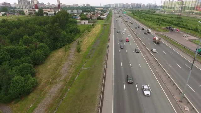 Traffic at the city ring highway. Camera flying across lanes. Transportation of St. Petersburg, Russia
