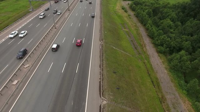 Aerial view at the ring highway. Camera flying across road. St. Petersburg, Russia
