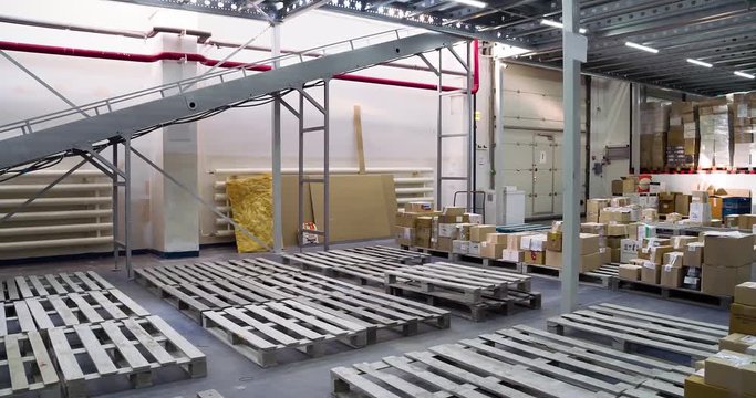 Indoor interior panorama of storage warehouse: cardboard boxes, pallets 4k video. Logistics stock industrial view
