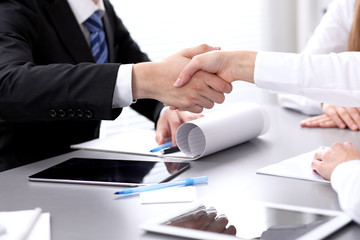 Business people shaking hands at meeting. Clouse up of handshake