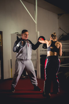 Coach training a student martial artist