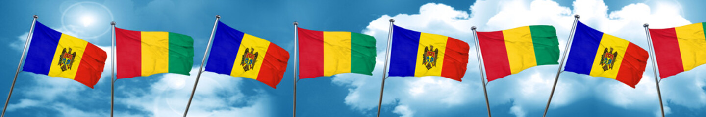 Moldova flag with Guinea flag, 3D rendering
