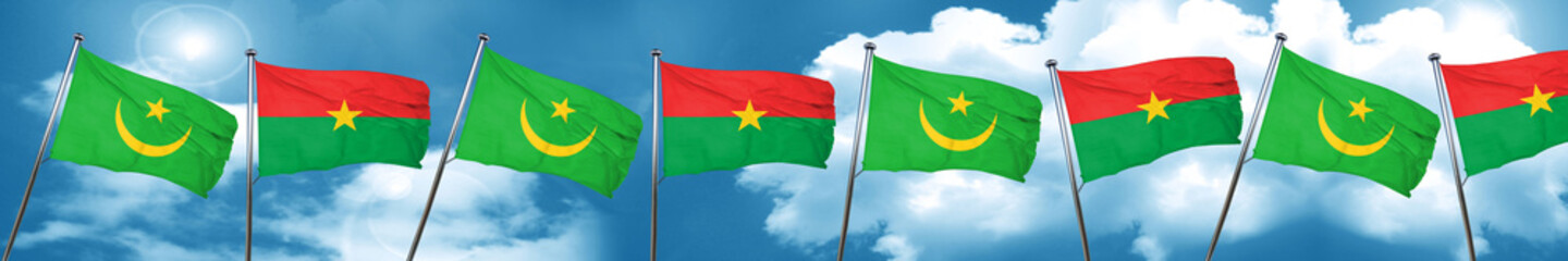 Mauritania flag with Burkina Faso flag, 3D rendering