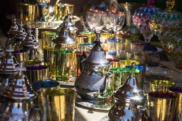 Fototapeta na wymiar Arabic teapot, various glass vessels with many colors, typical s