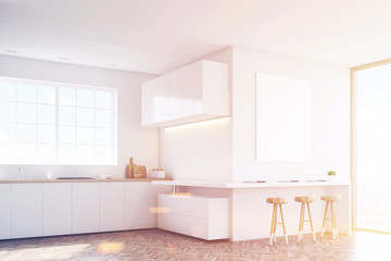 Side view of kitchen countertop and poster, toned