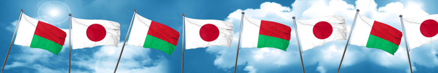 Madagascar flag with Japan flag, 3D rendering