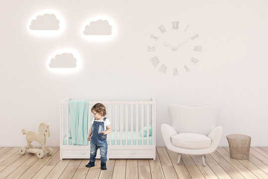 Boy in kidâ€™s room with clocks, white walls