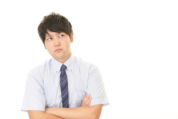 困惑した表情のビジネスマン