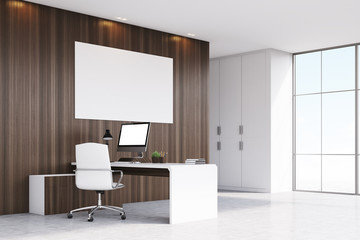 Corner of CEO office with window and poster